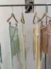 Top de punto Omalai con nudo de lazo, abalorios, hombros descubiertos y manga larga con un nuevo diseño para primavera 6557