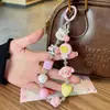 Alça de celular com laço na cor dopamina, corrente de porquinho de desenho animado em formato de coração, pingente de bolsa em cores de doce
