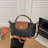 Bolsa de tela de nailon para mujer, gran capacidad, nuevo verano 2026, versátil, casual, de un solo hombro, cruzada, bolsa de mano para estudiantes, clase