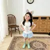 Conjunto de Duas Peças de Calça Floral de Verão 2026 para Meninas Pequenas, Doce Conjunto de Calça Saia com Laço 3D e Manga Bufante de Coelho