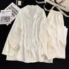 Directo de fábrica para pareja, seda de hielo, manga larga, moda de lujo simple para hombre y mujer, pijama para casa con estampado para primavera y verano
