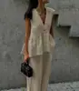 Conjunto de chaleco de cuello en V estilo francés y pantalón largo, nuevo para 2026, con diseño entallado a la cintura, top sin mangas y un look chic y profesional para la oficina