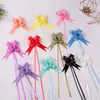 Comercio exterior transfronterizo 30 mediano elegante color sólido lazo flor dibujada a mano regalo decoración navideña flor dibujada flor cinta