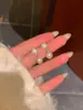 Brincos de tarraxa Agulha de Prata versáteis e delicados, primeiro amor, outono e inverno, oito estrelas Awn, floco de neve de pérola, design de nicho ins, brincos de alta qualidade