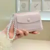 Daini Versión Coreana Nuevo Patrón Agrietado Color Sólido Simple Colgante de Lazo de Perla 80% de descuento Cierre de Cremallera Cartera Corta