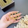 Pendientes de círculo trenzado de oro de arena de Vietnam Europa y Estados Unidos transfronterizos geométricos retorcidos no se decoloran durante mucho tiempo joyería de oreja de cobre chapada en oro al por mayor