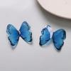 Super hada degradado brillante epoxi tridimensional exagerado mariposa pendientes accesorios para el cabello collar DIY todo-partido accesorios de joyería al por mayor