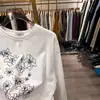 Camiseta holgada de manga larga para mujer estilo coreano para otoño e invierno, hecha de seda de leche con acabado doblemente cepillado, top de longitud media estilo ins para mujer, venta al por mayor transfronteriza