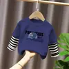 Camiseta base para niño 2026 nuevo modelo camiseta de manga larga a rayas patchwork para niños top de algodón puro otoño para niños mayores