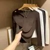 Versátil camiseta interior hueca para otoño e invierno, de cuello redondo para mujer, tejido de alta elasticidad, corte entallado que estiliza, diseño de hombro normal, color liso, manga larga