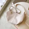 Coreia do Sul primavera e verão nova bolsa plissada estilo dumpling retrô minimalista bolsa feminina ins bolsa de ombro transversal tendência para o dia a dia bolsa de chifre