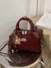 Bolso tipo Boston transfronterizo de nicho para mujer, nuevo bolso de hombro de moda 2026 con patrón de diamantes, bolso bandolera de cadena exquisito