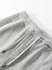 Pantalones deportivos casuales de corte curvo para hombre, ajuste holgado, caída, versátiles, para el día a día y el deporte