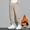 Calça de veludo cotelê grossa com forro de fleece para outono e inverno, calça esportiva casual solta da moda, calça combinável para homens