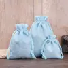 Bolsas de armazenamento multicoloridas com cordão feitas de linho, adequadas para organizar joias, podem ser impressas com logotipos e padrões, e são adequadas para cosméticos, feitas de material compósito imitando linho