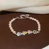 [Cadena de Diamantes Arcoíris] Pulsera de extracción de zircón trenzado en cruz, una pulsera lujosa y de alta gama, una pieza de joyería delicada y de moda
