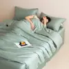 Conjunto de Roupa de Cama de Quatro Peças em Lyocell Tencel de Luxo Leve, Lençol de Cama e Capa de Edredom de Seda Gelada para o Verão, Roupa de Cama de Alta Qualidade Novo Modelo 2026 Atacado