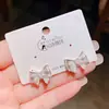 Pendientes de Lazo Blanco Lunar Dinámico de Nueva Generación con Electrólisis Plateada de Color Conservante para Mujer, Estilo Coreano, Pendientes Versátiles de Gama Alta para el Día a Día