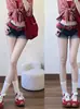 Shorts de mezclilla con dobladillo enrollado estilo americano para mujer, nuevo modelo de verano, tiro bajo, elásticos, adelgazantes, de corte A, ajustados a la cadera, hot pants
