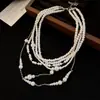 Collar de perlas de múltiples capas vintage francés, estilo de lujo ligero y de alta gama, cadena elegante para la clavícula, nuevo accesorio para mujer 2026