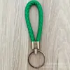 Llavero de cuerda de cuero trenzado simple creativo colgante de muñeca linda accesorios de llave para parejas tendencia regalos pequeños venta al por mayor