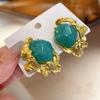Pendientes elegantes vintage de cristal verde exagerado de estilo antiguo medio nicho, pendientes de lujo ligeros de estilo europeo y americano de estilo francés.