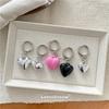 Nuevo colgante coreano de plata con forma de corazón rojo y rosa negra, bonito y moderno llavero para bolso de coche para mujer.
