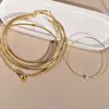 Variedad de acero inoxidable europeo y americano collar gargantilla femenina simple cuerpo ligero anillo imitación oro 18K perlas artificiales