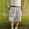 Verano transfronterizo europeo y americano nuevo moda callejera americana holgados casual pantalones cortos para correr pantalones de chándal deportivos de cinco puntos hombres y mujeres