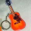 Nuevo Llavero Simple Colgante para Llave de Coche Mochila Decoración Instrumento Musical Guitarra Compacta Acrílico de Alto Valor