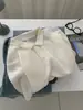 Exquisita Camiseta Polo Manga Curta Jacquard Vazado Retrô Tricotada Feminina Estilo Francês Branco Gelo Seda de Gelo Verão 2026