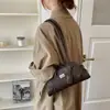 Bolsa de ombro coreana de design nicho para mulheres, nova bolsa de mão da moda 2025, bolsa bowling versátil, adequada para o dia a dia, bolsa de ombro