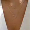 Colar de anel duplo em formato de coração cravejado com strass, estilo cruzado mais vendido para mulheres, corrente de clavícula de liga ins, design de nicho, sensação de nicho de luxo leve