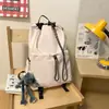 Bolso cubo con cordón de tela de nailon estilo coreano nuevo para mujer, mochila de viaje versátil, mochila escolar de gran capacidad para estudiantes, moda