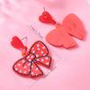 Novos brincos de design de amor com pontos de arco transfronteiriços, personalidade do Coringa, moda coreana, fábrica de atacado