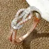 Anillo Elegante de Dos Tonos Cao Shi Metal Electrochapado para Mujer Circonita Microincrustada Anillo de Moda Joyería con Diseño de Cuerda Anudada