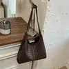 Bolsa de ombro retrô Shuai Mi Jia para mulheres 2026 nova moda trançada grande capacidade simples elegante bolsa de mão bolsa tote