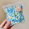 Gomas para el pelo al por mayor para niños, Lindas y suaves con el cabello, Bandas elásticas de alta elasticidad, Cuerdas para el pelo del tamaño del pulgar para niñas, Accesorios para el pelo de pequeña mercancía de Yiwu