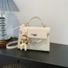 Bolsa Cruzada para Mujer Estilo Coreano Linda de Mono Pequeño Colgante, Moda Simple Versátil para Viajar, Bolso Kelly