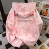 Sudadera con capucha estampada de animación de líneas de dibujos animados Otoño e Invierno 2025 Estilo Campus Divertido Americano Mujer Parte superior rosa tie-dye