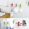 A2823 Deformación aleatoria creativa del soporte para pasta de dientes con forma de abrazo de personita, gancho para baño múltiple