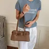Bolsa de antebraço feminina 2026 novo design retrô fashion versátil com blocos de cor para o trabalho e uso casual, bolsa de ombro único