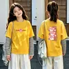 Camiseta de manga larga tipo dos piezas de imitación para niños, colección otoño 2026, para niñas, 100% algodón, cuello redondo, corte holgado, diseño lindo de caricatura, top básico