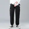 Pantalones pantalones casuales para hombre coreanos primavera y otoño pantalones atados al tobillo moda deportiva color liso para hombre microelástico red-hot mismo estilo overol