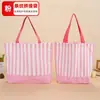 Bolsa de lona com retalhos listrados exclusiva transfronteiriça, bolsa tote de lona com blocos de cor para carregar na mão, pedidos de comércio exterior podem ser personalizados com impressão