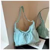 Bolsa de tela de comercio exterior 2026 verano nueva moda nicho plisada bolsa tote gran capacidad para ir al trabajo hombro bandolera bolso moderno