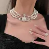 Popular Exquisito Colgante de Planeta Collar de Perlas Lujo Ligero Cadena de Clavícula de Gama Alta Moda de Nicho Versátil Collar Venta al por Mayor