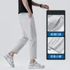 Pantalones casuales para hombre, pantalones cropped modernos estilo coreano para jóvenes, pantalones finos de seda helada elástica de cintura media para verano