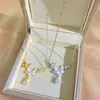 Nuevo collar de acero de titanio con borlas de gota de agua y doble mariposa, diseño simple con incrustaciones de circonita, cadena ligera de lujo para la clavícula, para mujer