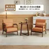Sillas de sofá de madera maciza estilo nórdico, muebles de ocio para balcón, juegos populares para cafeterías y hoteles, y mesas y sillas de recepción para reuniones y encuentros